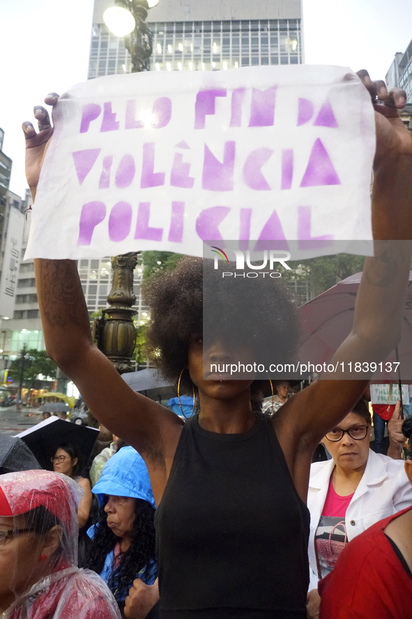 Demonstrators shout slogans as they participate in a protest against Sao Paulo's governor, Tarcisio de Freitas, and the violence of the poli...