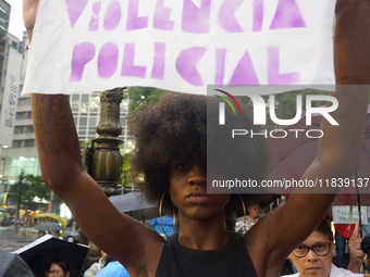 Demonstrators shout slogans as they participate in a protest against Sao Paulo's governor, Tarcisio de Freitas, and the violence of the poli...