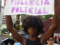 Demonstrators shout slogans as they participate in a protest against Sao Paulo's governor, Tarcisio de Freitas, and the violence of the poli...