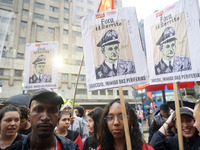 Demonstrators shout slogans as they participate in a protest against Sao Paulo's governor, Tarcisio de Freitas, and the violence of the poli...