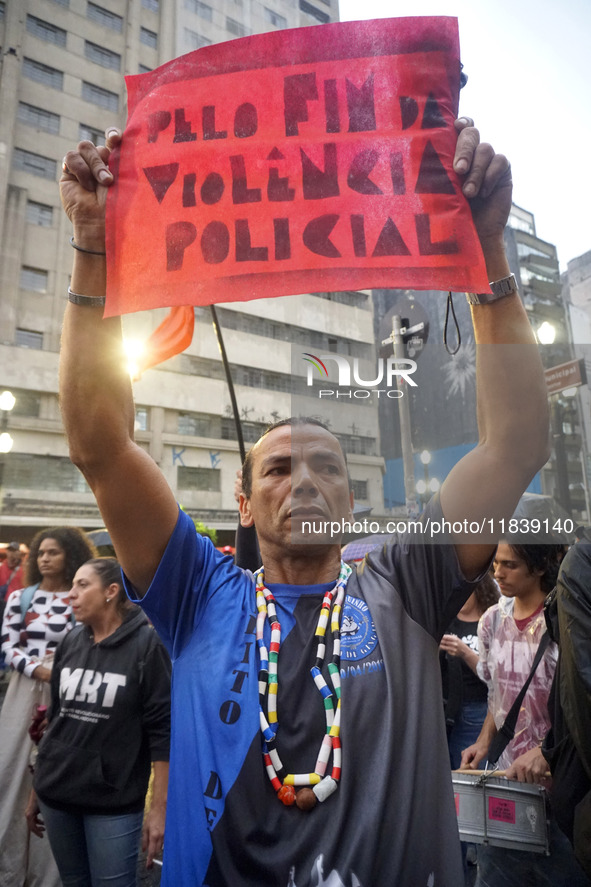 Demonstrators shout slogans as they participate in a protest against Sao Paulo's governor, Tarcisio de Freitas, and the violence of the poli...