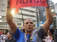 Demonstrators shout slogans as they participate in a protest against Sao Paulo's governor, Tarcisio de Freitas, and the violence of the poli...