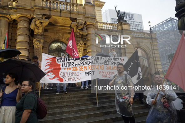 Demonstrators shout slogans as they participate in a protest against Sao Paulo's governor, Tarcisio de Freitas, and the violence of the poli...