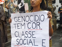 Demonstrators shout slogans as they participate in a protest against Sao Paulo's governor, Tarcisio de Freitas, and the violence of the poli...