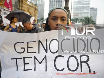 Demonstrators shout slogans as they participate in a protest against Sao Paulo's governor, Tarcisio de Freitas, and the violence of the poli...