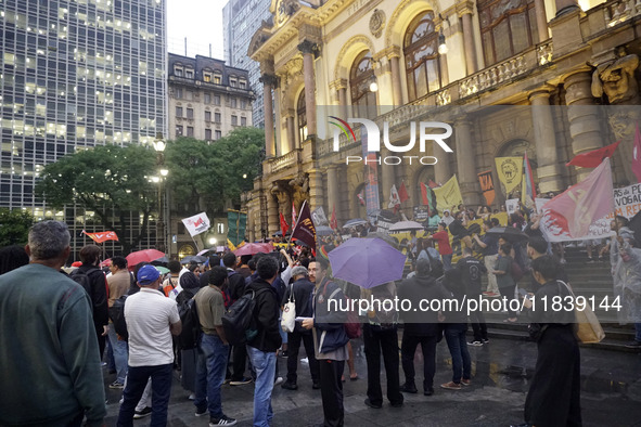 Demonstrators shout slogans as they participate in a protest against Sao Paulo's governor, Tarcisio de Freitas, and the violence of the poli...