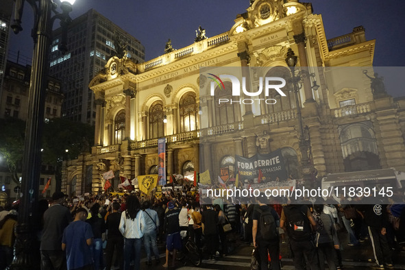 Demonstrators shout slogans as they participate in a protest against Sao Paulo's governor, Tarcisio de Freitas, and the violence of the poli...