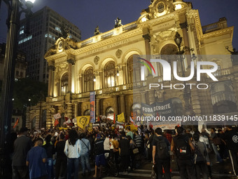 Demonstrators shout slogans as they participate in a protest against Sao Paulo's governor, Tarcisio de Freitas, and the violence of the poli...