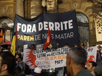 Demonstrators shout slogans as they participate in a protest against Sao Paulo's governor, Tarcisio de Freitas, and the violence of the poli...