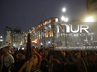 Demonstrators shout slogans as they participate in a protest against Sao Paulo's governor, Tarcisio de Freitas, and the violence of the poli...