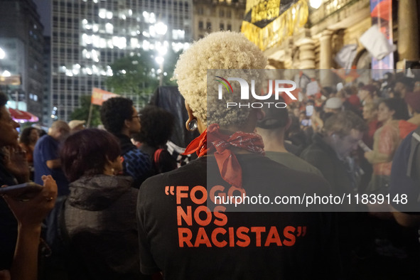 Demonstrators shout slogans as they participate in a protest against Sao Paulo's governor, Tarcisio de Freitas, and the violence of the poli...