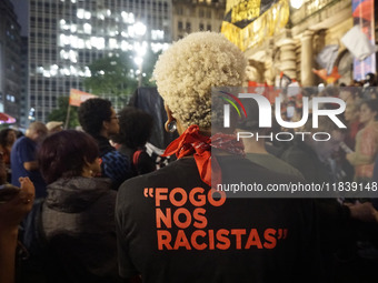 Demonstrators shout slogans as they participate in a protest against Sao Paulo's governor, Tarcisio de Freitas, and the violence of the poli...