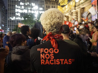 Demonstrators shout slogans as they participate in a protest against Sao Paulo's governor, Tarcisio de Freitas, and the violence of the poli...