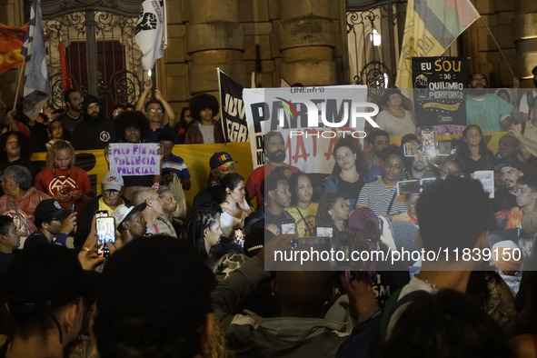 Demonstrators shout slogans as they participate in a protest against Sao Paulo's governor, Tarcisio de Freitas, and the violence of the poli...