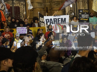 Demonstrators shout slogans as they participate in a protest against Sao Paulo's governor, Tarcisio de Freitas, and the violence of the poli...