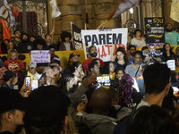 Demonstrators shout slogans as they participate in a protest against Sao Paulo's governor, Tarcisio de Freitas, and the violence of the poli...