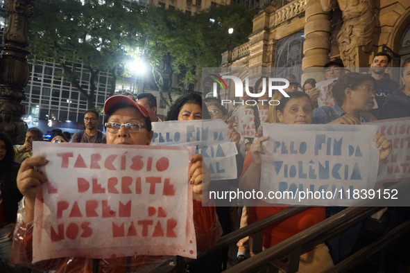 Demonstrators shout slogans as they participate in a protest against Sao Paulo's governor, Tarcisio de Freitas, and the violence of the poli...