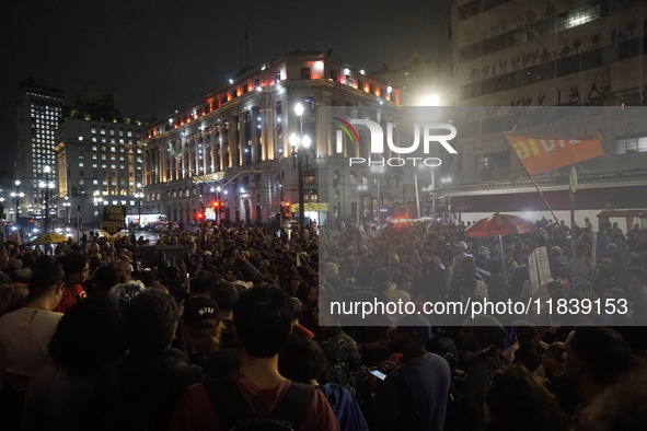 Demonstrators shout slogans as they participate in a protest against Sao Paulo's governor, Tarcisio de Freitas, and the violence of the poli...