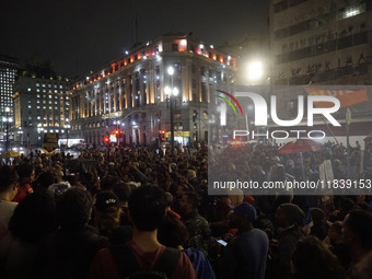 Demonstrators shout slogans as they participate in a protest against Sao Paulo's governor, Tarcisio de Freitas, and the violence of the poli...