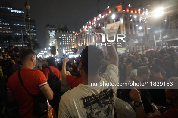 Demonstrators shout slogans as they participate in a protest against Sao Paulo's governor, Tarcisio de Freitas, and the violence of the poli...