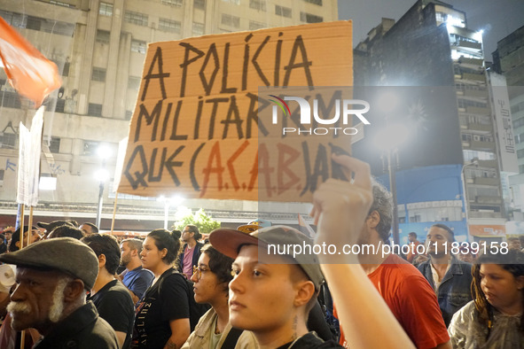 Demonstrators shout slogans as they participate in a protest against Sao Paulo's governor, Tarcisio de Freitas, and the violence of the poli...