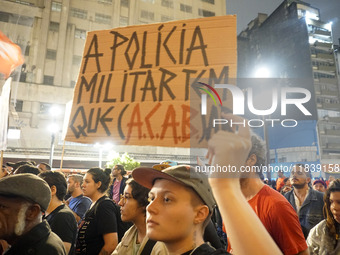 Demonstrators shout slogans as they participate in a protest against Sao Paulo's governor, Tarcisio de Freitas, and the violence of the poli...