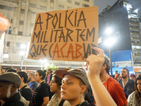 Demonstrators shout slogans as they participate in a protest against Sao Paulo's governor, Tarcisio de Freitas, and the violence of the poli...