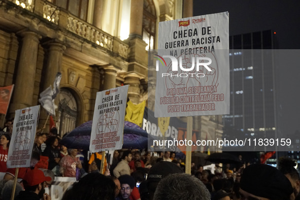 Demonstrators shout slogans as they participate in a protest against Sao Paulo's governor, Tarcisio de Freitas, and the violence of the poli...