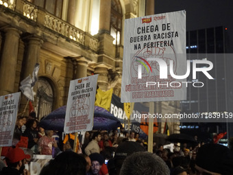 Demonstrators shout slogans as they participate in a protest against Sao Paulo's governor, Tarcisio de Freitas, and the violence of the poli...