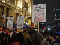 Demonstrators shout slogans as they participate in a protest against Sao Paulo's governor, Tarcisio de Freitas, and the violence of the poli...