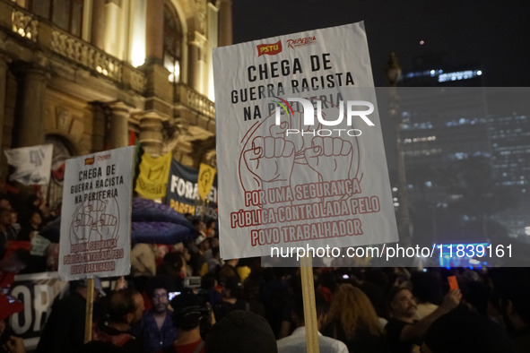 Demonstrators shout slogans as they participate in a protest against Sao Paulo's governor, Tarcisio de Freitas, and the violence of the poli...