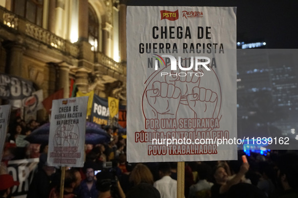 Demonstrators shout slogans as they participate in a protest against Sao Paulo's governor, Tarcisio de Freitas, and the violence of the poli...