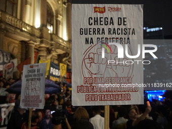 Demonstrators shout slogans as they participate in a protest against Sao Paulo's governor, Tarcisio de Freitas, and the violence of the poli...