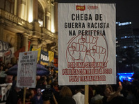 Demonstrators shout slogans as they participate in a protest against Sao Paulo's governor, Tarcisio de Freitas, and the violence of the poli...