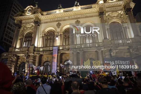 Demonstrators shout slogans as they participate in a protest against Sao Paulo's governor, Tarcisio de Freitas, and the violence of the poli...