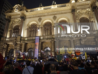 Demonstrators shout slogans as they participate in a protest against Sao Paulo's governor, Tarcisio de Freitas, and the violence of the poli...