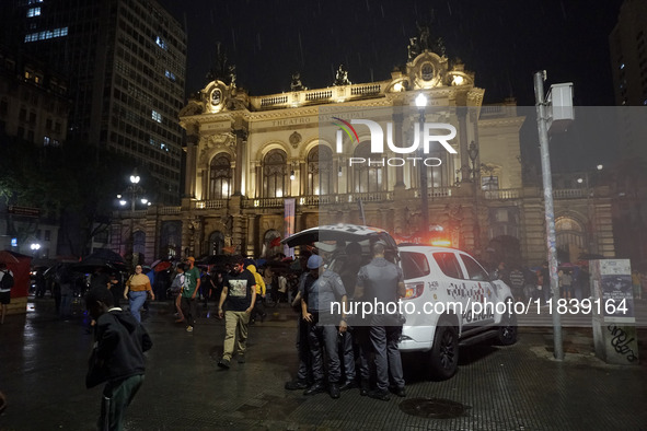 Demonstrators shout slogans as they participate in a protest against Sao Paulo's governor, Tarcisio de Freitas, and the violence of the poli...