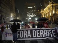 Demonstrators shout slogans as they participate in a protest against Sao Paulo's governor, Tarcisio de Freitas, and the violence of the poli...