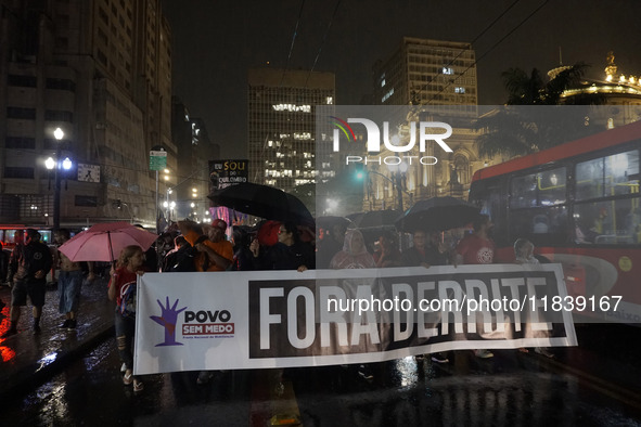 Demonstrators shout slogans as they participate in a protest against Sao Paulo's governor, Tarcisio de Freitas, and the violence of the poli...