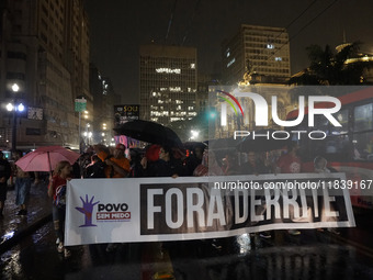 Demonstrators shout slogans as they participate in a protest against Sao Paulo's governor, Tarcisio de Freitas, and the violence of the poli...