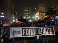 Demonstrators shout slogans as they participate in a protest against Sao Paulo's governor, Tarcisio de Freitas, and the violence of the poli...