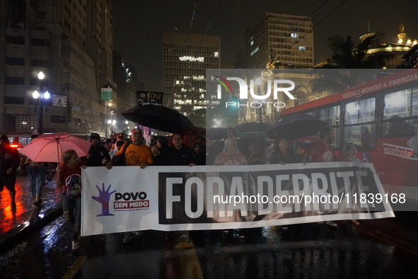 Demonstrators shout slogans as they participate in a protest against Sao Paulo's governor, Tarcisio de Freitas, and the violence of the poli...