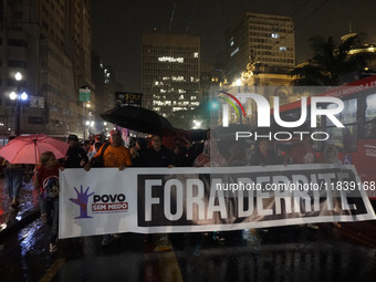 Demonstrators shout slogans as they participate in a protest against Sao Paulo's governor, Tarcisio de Freitas, and the violence of the poli...