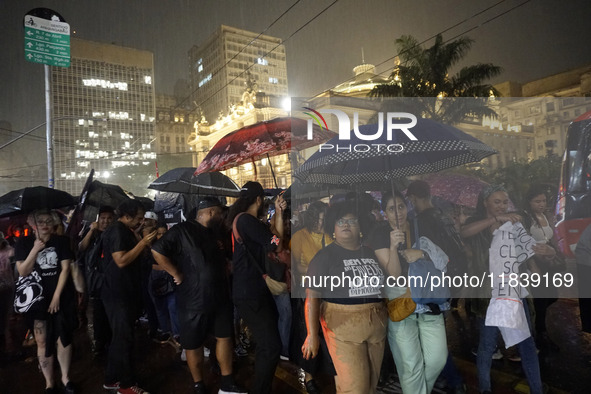 Demonstrators shout slogans as they participate in a protest against Sao Paulo's governor, Tarcisio de Freitas, and the violence of the poli...