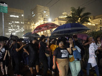 Demonstrators shout slogans as they participate in a protest against Sao Paulo's governor, Tarcisio de Freitas, and the violence of the poli...