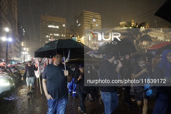 Demonstrators shout slogans as they participate in a protest against Sao Paulo's governor, Tarcisio de Freitas, and the violence of the poli...