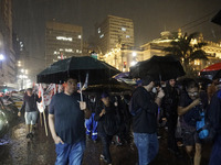 Demonstrators shout slogans as they participate in a protest against Sao Paulo's governor, Tarcisio de Freitas, and the violence of the poli...