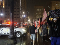 Demonstrators shout slogans as they participate in a protest against Sao Paulo's governor, Tarcisio de Freitas, and the violence of the poli...