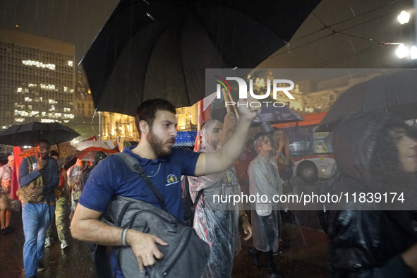 Demonstrators shout slogans as they participate in a protest against Sao Paulo's governor, Tarcisio de Freitas, and the violence of the poli...