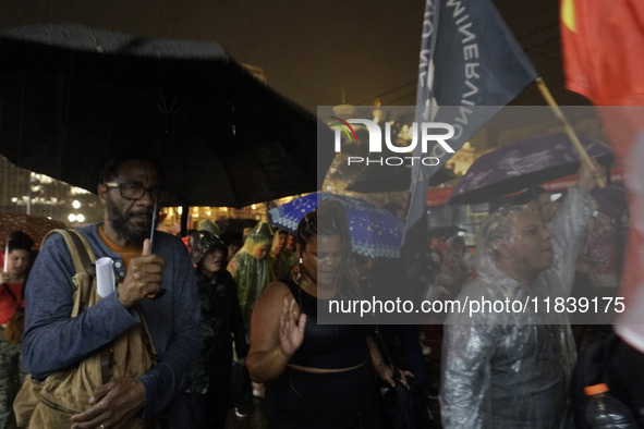 Demonstrators shout slogans as they participate in a protest against Sao Paulo's governor, Tarcisio de Freitas, and the violence of the poli...